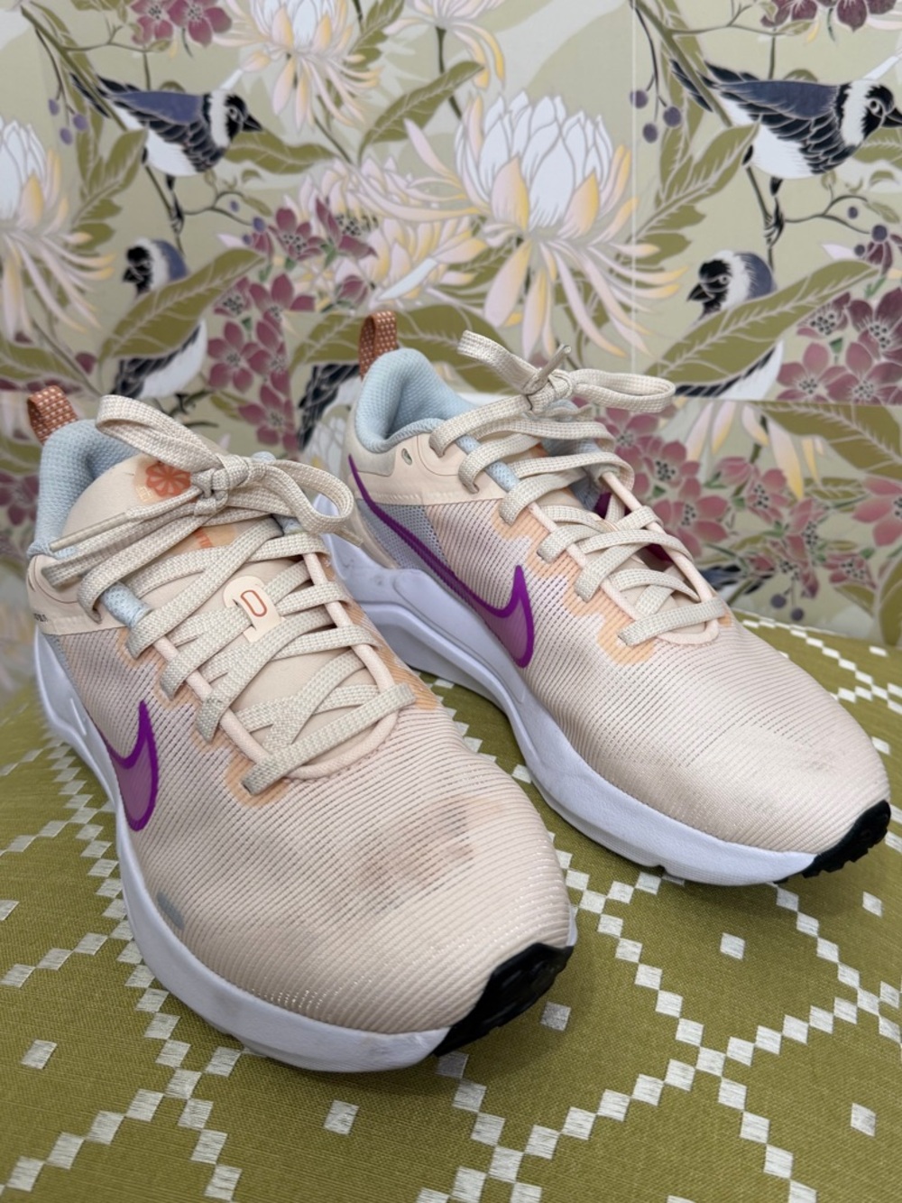Nike Women's Cream Running Sneakers with Purple Swoosh Accent